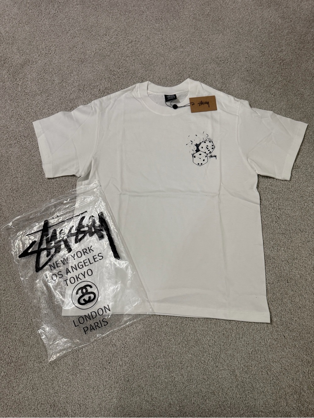 Stussy White Tee with Black Dice Graphic and Tag